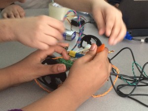 Students collaborate in building their robotic vehicle.